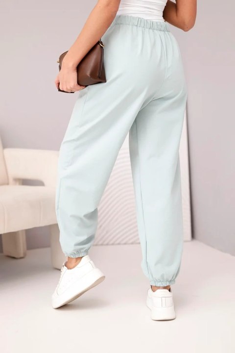 Spodnie damskie bawełniane z wysokim stanem i ozdobnym guzikiem ciemno miętowe