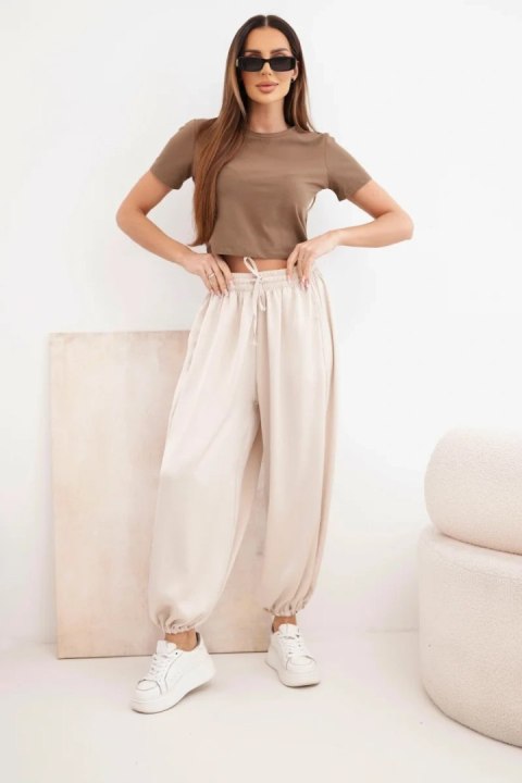 Beżowe spodnie damskie alladynki z szeroką nogawką