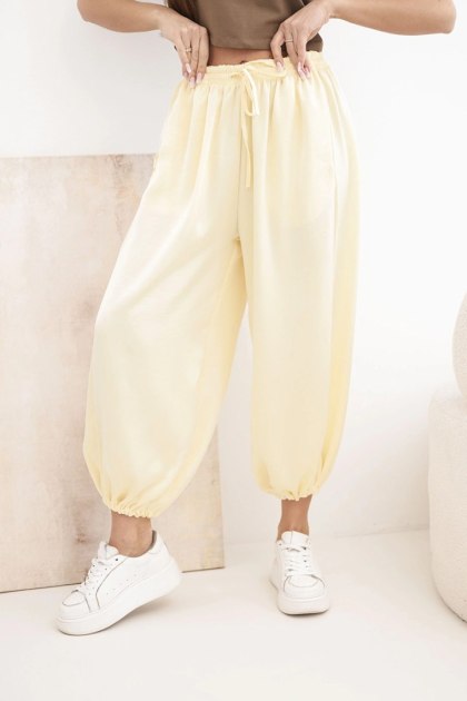 Spodnie damskie szerokie z gumką w pasie i wiązaniem typu alladynki żółte