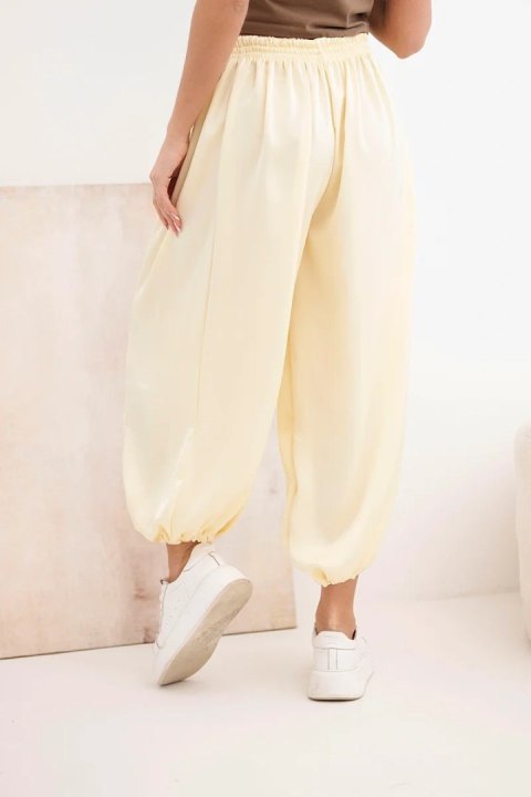 Spodnie damskie szerokie z gumką w pasie i wiązaniem typu alladynki żółte