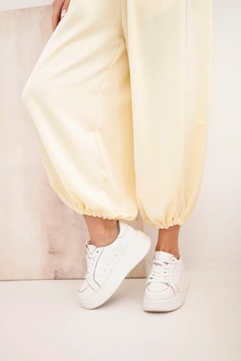 Spodnie damskie szerokie z gumką w pasie i wiązaniem typu alladynki żółte