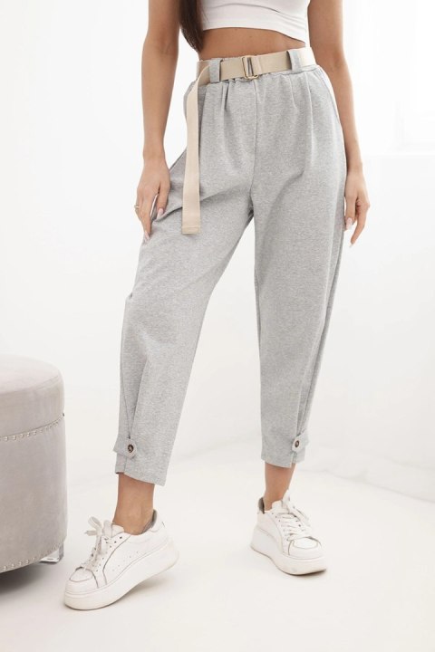 Spodnie Summer Punto szary melanż z ozdobnym zapięciem – dlaczego to fundament nowoczesnej elegancji?  Wybór spodni Summer Punto w odcieniu szary melanż to strategiczna decyzja dla kobiet, które poszukują balansu między biurowym profesjonalizmem a swobodą